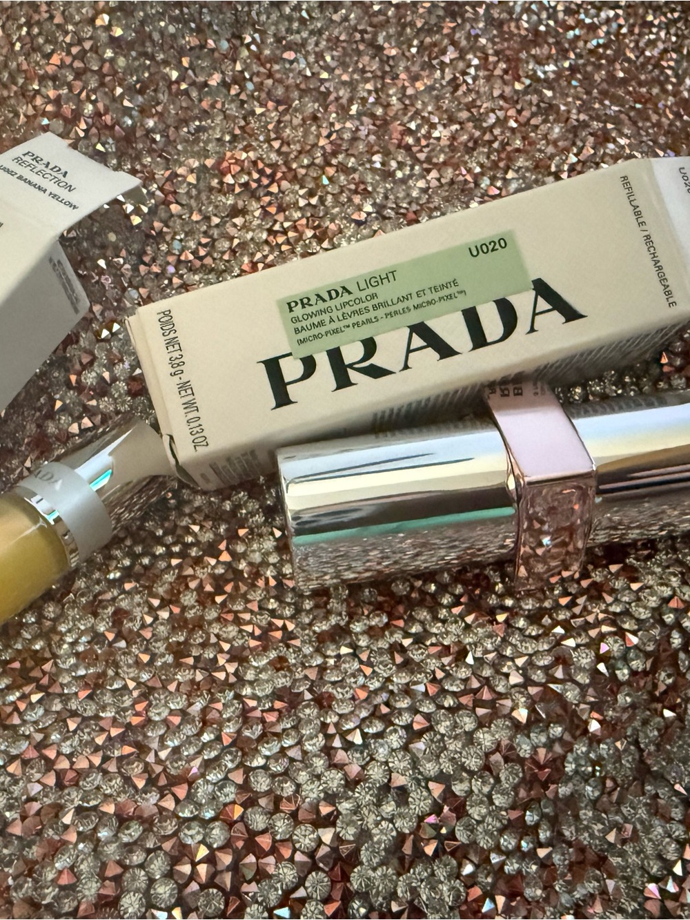 Prada light refillable lipstick and Prada mini gloss